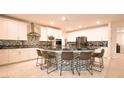 Kitchen with modern stainless appliances, ample counter space, and stylish high top seating at 2913 Monate Ct, Henderson, NV 89044