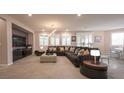 Expansive living room with plush seating, modern decor, and large windows for natural light at 2913 Monate Ct, Henderson, NV 89044