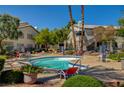 Enjoy the community pool surrounded by lush landscaping, seating and beautiful multi-story buildings at 3060 Tarpon Dr # 102, Las Vegas, NV 89120