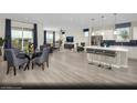 Open concept design with views of kitchen, dining, and living room with modern decor at 314 S Parawan St # Lot 13, Henderson, NV 89015