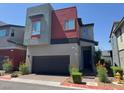 Modern two-story home with attached garage and contemporary design elements at 3194 Lumassina Way, Henderson, NV 89044