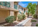 Beautiful condo exterior features colorful desert landscaping and building architecture at 5155 W Tropicana Ave # 2017, Las Vegas, NV 89103