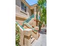 Condominium architectural exterior features colorful desert landscaping at 5155 W Tropicana Ave # 2017, Las Vegas, NV 89103