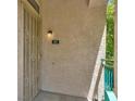 Front door entrance with security door and a wall lamp at 5155 W Tropicana Ave # 2017, Las Vegas, NV 89103