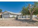 A charming single-story home with attached two-car garage and rock front yard at 5368 Regal Ave, Las Vegas, NV 89146