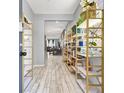 Inviting entryway featuring stylish shelving and a clear view into the living spaces at 6106 Castle Gardens Ave, Las Vegas, NV 89130