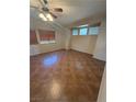 Spacious living room with high ceilings, neutral walls and updated tile floors at 6425 Sierra Sands St, North Las Vegas, NV 89086