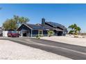 Charming home with solar panels, a driveway, and an attached two-car garage at 7135 Polaris Ave, Las Vegas, NV 89118