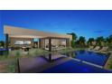 Luxurious backyard with a pool, lounge area, and outdoor dining space, perfect for entertaining at 7390 Heron Canyon Ct, Las Vegas, NV 89117