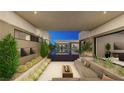 Inviting outdoor living area with a fire pit, comfortable seating, and lush landscaping at 7390 Heron Canyon Ct, Las Vegas, NV 89117