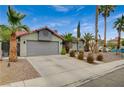 Charming single-story home featuring desert landscaping and a two-car garage at 770 Autumn Moon Dr, Las Vegas, NV 89123