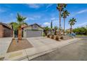 Charming single-story home featuring desert landscaping and a two-car garage at 770 Autumn Moon Dr, Las Vegas, NV 89123