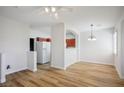 Bright and spacious living room featuring wood floors, modern lighting, and open layout, perfect for entertaining at 901 Nevada Sky St, Las Vegas, NV 89128