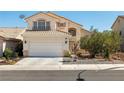 Attractive two-story home with tiled roof, two car garage, and tasteful landscaping at 9105 Chenin Ave, Las Vegas, NV 89129