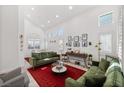 Bright and airy living room with high ceilings, large windows, and stylish decor at 9105 Chenin Ave, Las Vegas, NV 89129