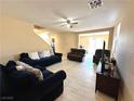 Bright living room with tile flooring, offering versatile space for living and entertaining at 9148 Patrick Henry Ave, Las Vegas, NV 89149
