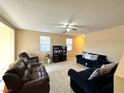 Open living room with ceiling fan and great natural light at 9148 Patrick Henry Ave, Las Vegas, NV 89149