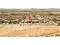 Aerial view of a residential neighborhood in a desert landscape at 9163 W Torino Ave, Las Vegas, NV 89148