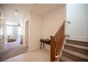 Welcoming entryway with tile floors, staircase and view into the spacious living room at 9451 Lunar Ray St, Las Vegas, NV 89143