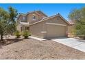 Inviting two story house, with a two car garage, and low maintenance front yard landscaping at 9625 Gatesville Ave, Las Vegas, NV 89148