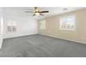 Bright and spacious bedroom with neutral paint, plush carpeting, and plenty of natural light at 11755 Garland Grove Ln, Las Vegas, NV 89183