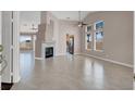 Spacious living room featuring a fireplace, large windows, and tile flooring at 118 Westin Ln, Henderson, NV 89002