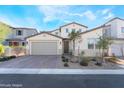 Charming home with a spacious paver driveway, two-car garage, and well-maintained front yard at 19 Cresta Villa Ct, Henderson, NV 89011
