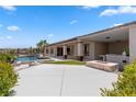 Spacious backyard featuring a pool, patio, outdoor kitchen, and fire pit perfect for relaxing and entertaining at 1950 Colvin Run Dr, Henderson, NV 89052