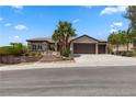 Stunning single-story home with a three-car garage, desert landscaping and an inviting entrance at 1950 Colvin Run Dr, Henderson, NV 89052