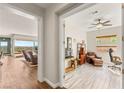 Bright, open-concept living area with hardwood floors, a ceiling fan, and large windows with natural light at 2069 Alto Vista Dr, Henderson, NV 89052