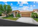 Charming single-story home featuring a well-manicured lawn and attached two-car garage at 2113 Scarlet Rose Dr, Las Vegas, NV 89134