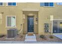 Charming front entrance with a dark blue door, complemented by a 'hello' welcome mat at 25 Barbara Ln # 42, Las Vegas, NV 89183