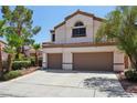 Lovely two-story home with an attached two-car garage and low-maintenance landscaping at 3320 Indian Moon Dr, Las Vegas, NV 89129