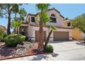 Beautiful home featuring well-manicured landscaping, desert accents, and a two-car garage at 3320 Indian Moon Dr, Las Vegas, NV 89129