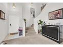 Bright entryway with a staircase and a decorative console table at 3389 Commendation Dr, Las Vegas, NV 89117