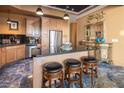 Charming kitchen with stainless steel appliances, granite countertops, and a convenient island with seating at 360 E Desert Inn Rd # 407, Las Vegas, NV 89109