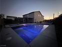 Backyard view with pool, spa, and covered patio perfect for outdoor living and entertaining at 5660 Oasis Ridge St, North Las Vegas, NV 89031