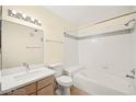 Clean bathroom featuring white tile and a shower-tub combination at 7885 W Flamingo Rd # 1131, Las Vegas, NV 89147