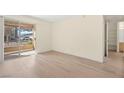Bright living room with sliding glass door to patio and views of community at 7885 W Flamingo Rd # 1131, Las Vegas, NV 89147