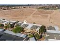 An aerial view of the community shows the building's location in a desert landscape at 8070 W Russell Rd # 1023, Las Vegas, NV 89113