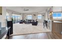 Open-concept living room with plush carpet and floor-to-ceiling windows at 8255 Las Vegas Blvd # 722, Las Vegas, NV 89123