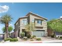 Charming two-story home with landscaped front yard and a two car garage at 9238 Bluemist Falls St, Las Vegas, NV 89123