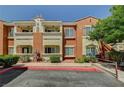 Attractive apartment building featuring a two-tone exterior with well-maintained landscaping at 9303 Gilcrease Ave # 2234, Las Vegas, NV 89149
