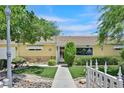 Inviting home with a stone-accented facade, manicured lawn, and walkway to the entrance at 1331 Melville Dr, Las Vegas, NV 89102