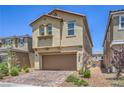 Charming two-story home with a paver driveway, a two-car garage, and desert landscaping at 3164 Bormida Ave, Henderson, NV 89044