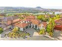 Gorgeous Mediterranean-style home with a red tile roof, manicured landscaping, and spacious three car garage at 4 Via Vittorio Pl, Henderson, NV 89011