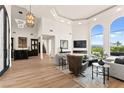 Bright living room boasts high ceilings, large windows with mountain views, and a stylish wet bar at 4 Via Vittorio Pl, Henderson, NV 89011