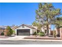 Charming single story home with well-maintained landscaping and a desert-friendly xeriscaped front yard at 410 Aloha Dr, Henderson, NV 89015