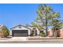 Charming single story home with well-maintained landscaping and a desert-friendly xeriscaped front yard at 410 Aloha Dr, Henderson, NV 89015