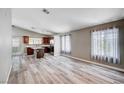 Open-concept living room featuring modern hardwood floors and neutral color palette, bright and inviting at 4212 Estaban Ct, Las Vegas, NV 89110